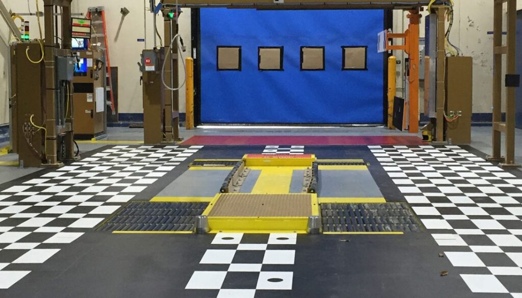 A blue and yellow checkered floor in a garage.