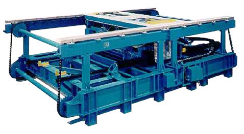 A blue machine that is used to make concrete blocks.