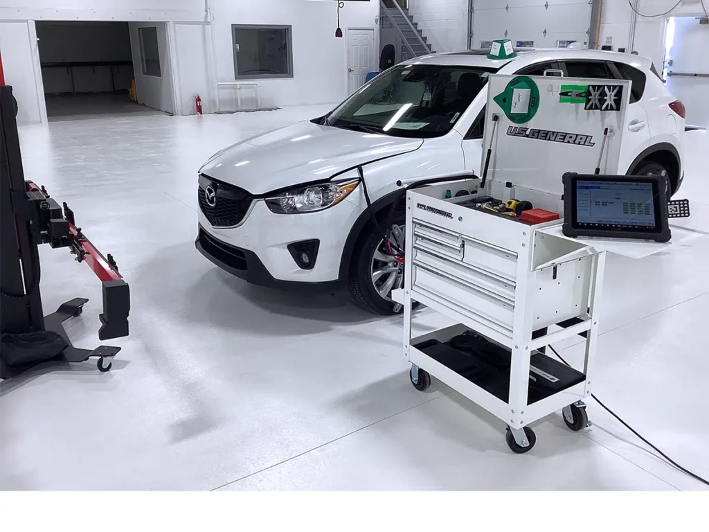 A mazda cx-5 is being tested in a garage.